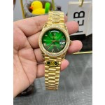 Sunday calendar series men's watch with gradient green dial, diamond-set bezel, and 40mm gold President-style bracelet.