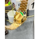 Sunday calendar series men's watch with gradient green dial, diamond-set bezel, and 40mm gold President-style bracelet.