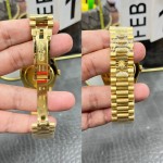 Sunday calendar series men's watch with gradient green dial, diamond-set bezel, and 40mm gold President-style bracelet.