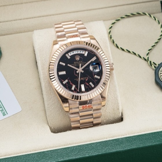 Sunday calendar series men's watch with hematite quartz dial, rose gold bezel, 40mm case, and rose gold President-style bracelet.