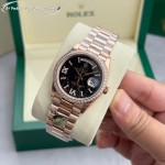 Sunday date display series women's watch with hematite-colored dial, diamond-set bezel, 36mm rose gold President-style bracelet.
