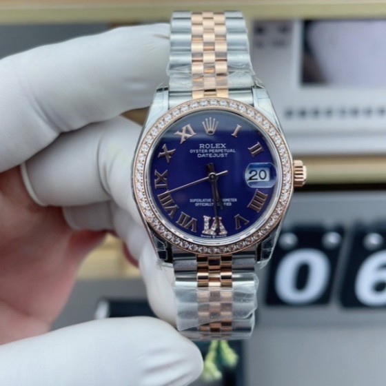 Datejust series, 31mm with purple dial and diamond setting, rose gold two-tone strap.