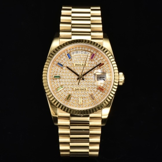 Sunday calendar series women's watch with diamond-set dial, gold bezel, 36mm case, and gold President-style bracelet.