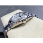 Sunday calendar series women's watch, mother-of-pearl dial, diamond-set bezel, 36mm, silver President-style bracelet.