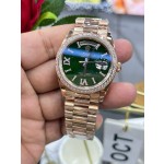 Sunday calendar series women's watch with diamonds, green dial, diamond-set bezel, 36mm, rose gold President-style bracelet.