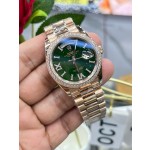 Sunday calendar series women's watch with diamonds, green dial, diamond-set bezel, 36mm, rose gold President-style bracelet.