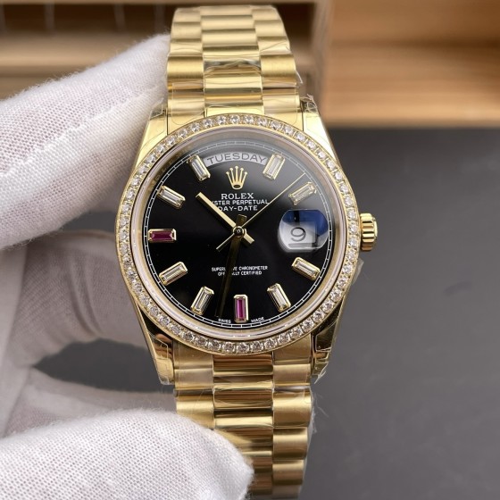 Sunday calendar series women's watch, black dial, diamond-set bezel, 36mm, gold President-style bracelet.