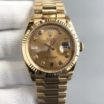 Sunday date display series women's watch with diamonds, gold dial, gold bezel, 36mm, gold President-style bracelet.