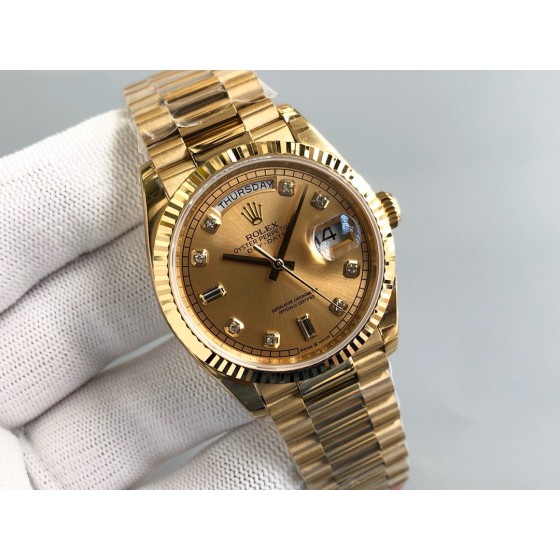 Sunday date display series women's watch with diamonds, gold dial, gold bezel, 36mm, gold President-style bracelet.