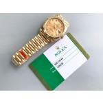 Sunday date display series women's watch with diamonds, gold dial, gold bezel, 36mm, gold President-style bracelet.