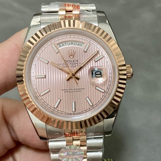 Sunday calendar series men's watch with pink dial, rose gold bezel, and 40mm two-tone five-link bracelet.