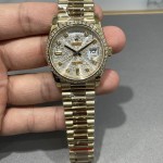 Sunday calendar series women's watch, silver dial, diamond-set bezel, 36mm, gold President-style bracelet.