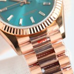 Sunday date display series women's watch, blue-green dial, rose gold bezel, 36mm, rose gold President-style bracelet.