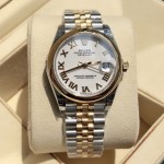 Datejust series women's watch, white dial, gold bezel, 31mm, two-tone five-link bracelet.