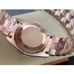 Sunday calendar series women's watch, black dial, diamond-set bezel, 36mm, rose gold President-style bracelet.