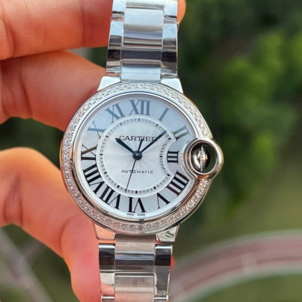 Cartier Ballon Bleu series, 33mm ladies' watch with silver dial and diamond setting, silver strap, mechanical movement.