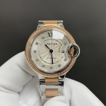 Cartier Ballon Bleu collection, 33mm silver dial with diamonds, rose gold two-tone strap, quartz watch.