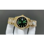 Sunday date display series women's watch, green dial, diamond-set bezel, 36mm, with diamond-set gold President-style bracelet.