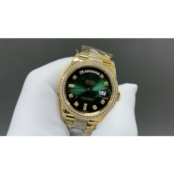 Sunday date display series women's watch, green dial, diamond-set bezel, 36mm, with diamond-set gold President-style bracelet.
