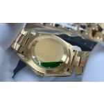 Sunday date display series women's watch, green dial, diamond-set bezel, 36mm, with diamond-set gold President-style bracelet.