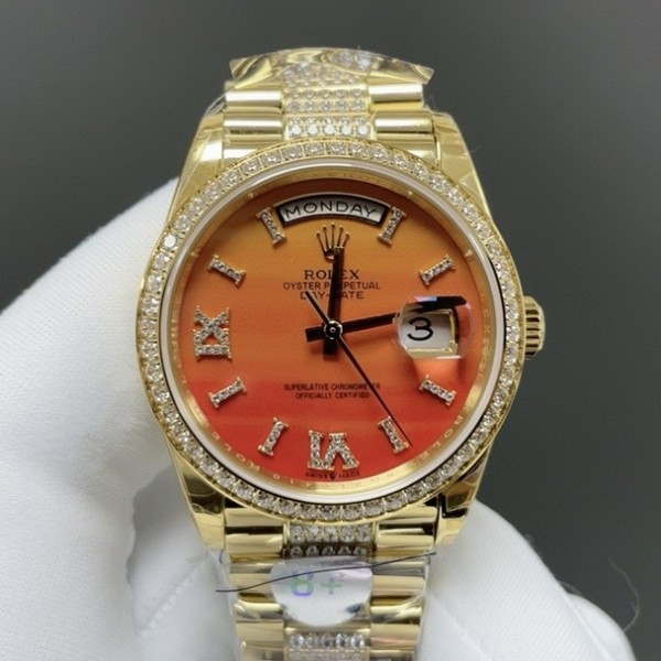 Sunday Calendar series women's watch with carnelian dial, diamond-set bezel, 36mm case, and diamond-set gold President-style bracelet.