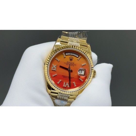 Sunday Calendar series women's watch with carnelian dial, diamond-set bezel, 36mm case, and diamond-set gold President-style bracelet.