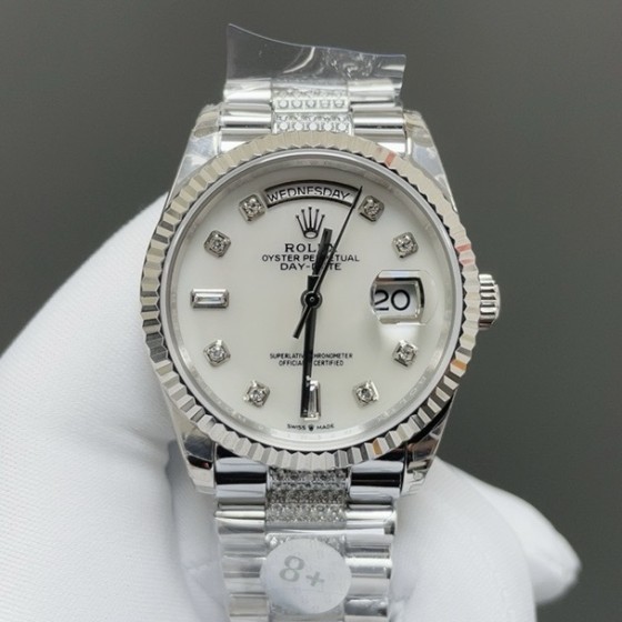 Sunday date display series women's watch, white dial, silver bezel, 36mm, with diamond-set silver President-style bracelet.