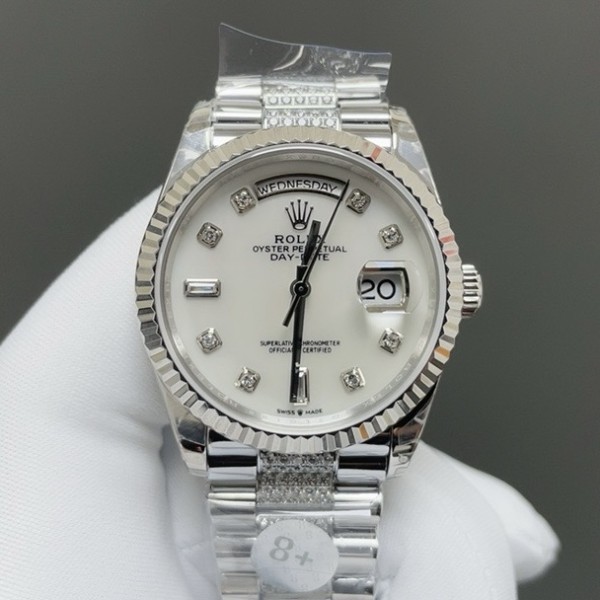 Sunday date display series women's watch, white dial, silver bezel, 36mm, with diamond-set silver President-style bracelet.
