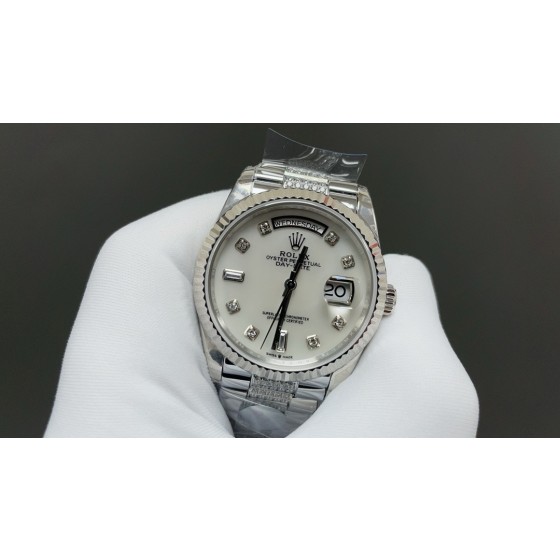 Sunday date display series women's watch, white dial, silver bezel, 36mm, with diamond-set silver President-style bracelet.