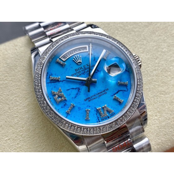 Sunday Calendar series women's watch, turquoise dial, diamond-set bezel, 36mm, silver President-style bracelet.