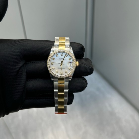 Datejust series, 31mm mother-of-pearl dial with diamonds, two-tone gold and silver strap.