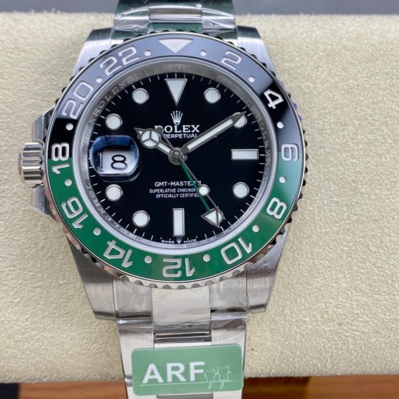 Rolex GMT-Master series, black dial, black and green bezel, 40mm, silver Oyster bracelet.
