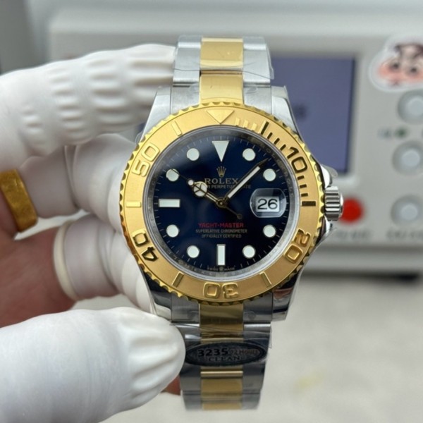 Yacht-Master series, black dial, gold bezel, 40mm, gold and silver bracelet.