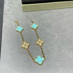 Four-leaf clover gold bracelet with rhinestones and blue accents