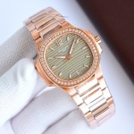 Patek Philippe Nautilus – Wave-pattern dial, rose gold bracelet, diamond-set bezel.