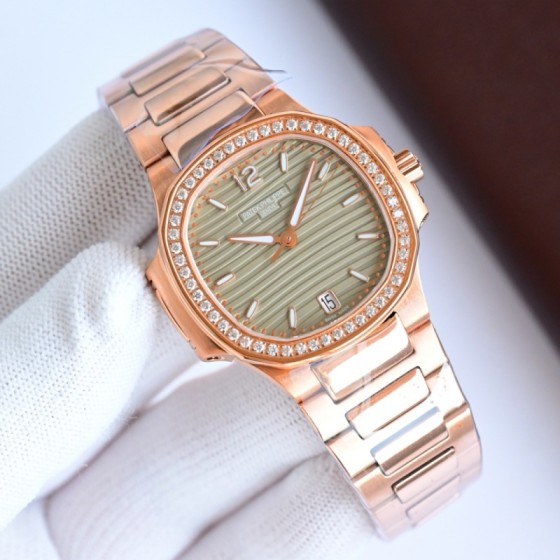 Patek Philippe Nautilus – Wave-pattern dial, rose gold bracelet, diamond-set bezel.