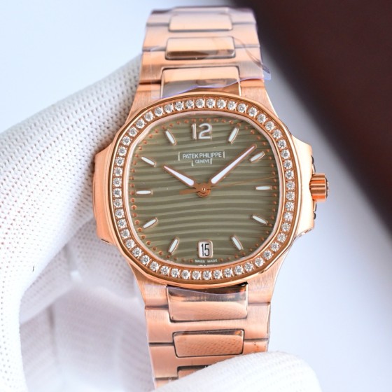 Patek Philippe Nautilus – Wave-pattern dial, rose gold bracelet, diamond-set bezel.