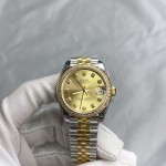 Datejust series, 31mm gold dial with diamonds, two-tone gold and silver strap.