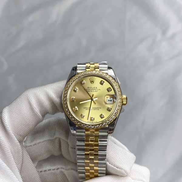 Datejust series, 31mm gold dial with diamonds, two-tone gold and silver strap.