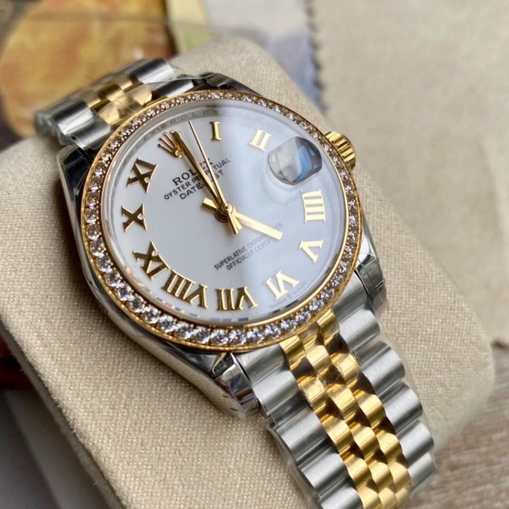 Datejust series, white dial with diamonds, 31mm, two-tone gold and silver strap.