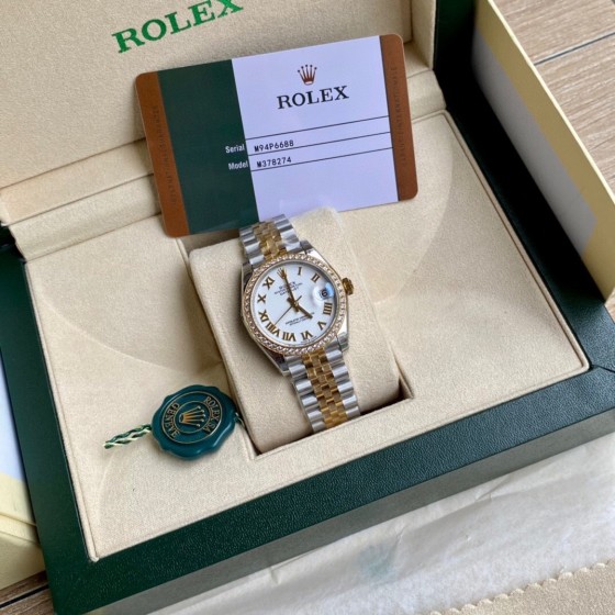 Datejust series, white dial with diamonds, 31mm, two-tone gold and silver strap.