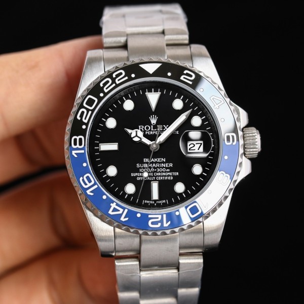 Rolex GMT-Master series, black dial, black and blue bezel, 40mm, silver Oyster bracelet.