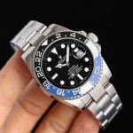 Rolex GMT-Master series, black dial, black and blue bezel, 40mm, silver Oyster bracelet.