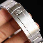 Rolex GMT-Master series, black dial, black and blue bezel, 40mm, silver Oyster bracelet.