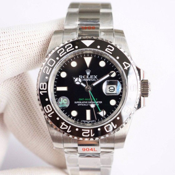 Rolex GMT-Master series, black dial, black bezel, 40mm, silver Oyster bracelet.