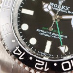 Rolex GMT-Master series, black dial, black bezel, 40mm, silver Oyster bracelet.
