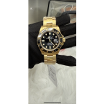 Rolex Submariner with black dial and gold bracelet, 40mm