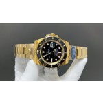 Rolex Submariner with black dial and gold bracelet, 40mm