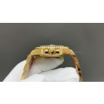 Rolex Submariner with black dial and gold bracelet, 40mm