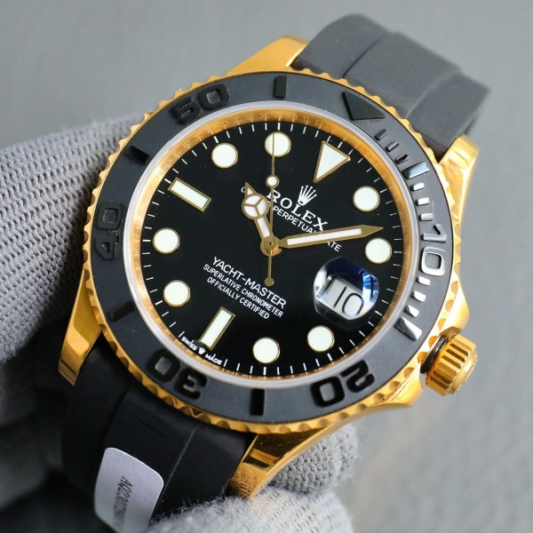 Rolex Yacht-Master series, black dial, black bezel, gold case, 40mm, rubber strap.
